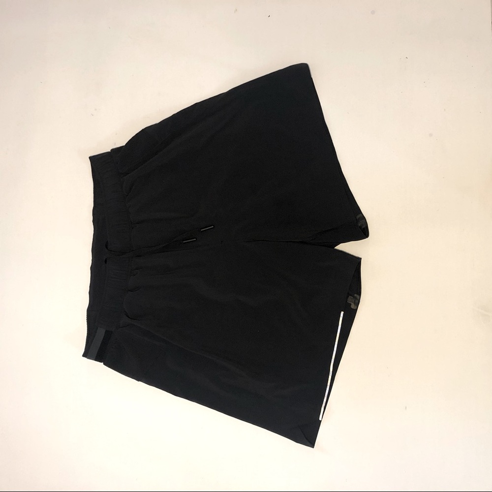 Black Lululemon women’s running shorts with tights